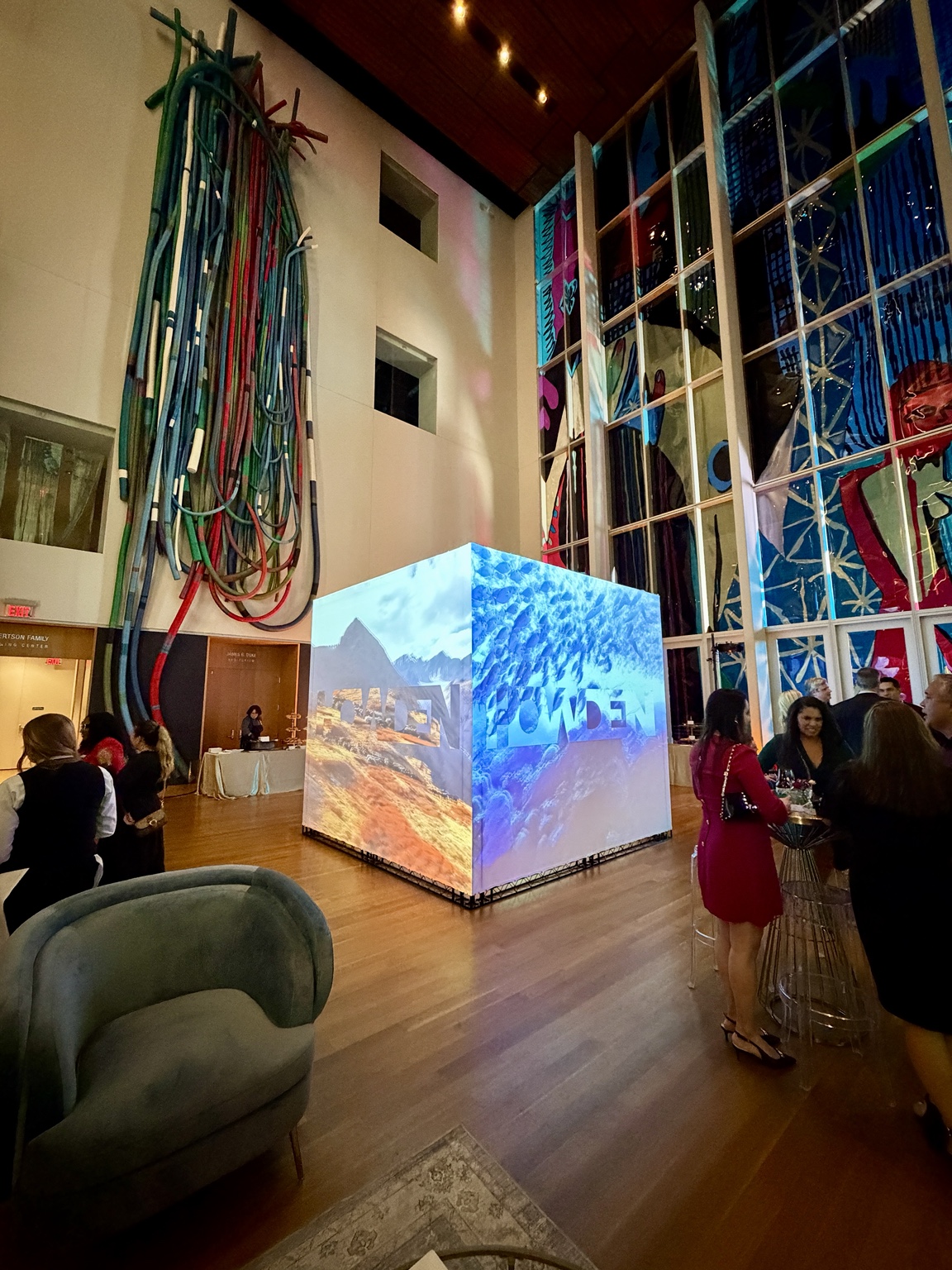 A custom projection Cube with mountain and underwater visuals at an indoor event