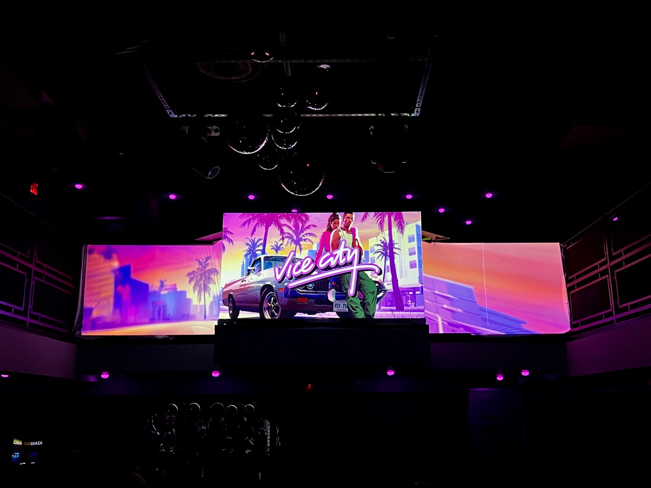 Vice City visuals across a multi-panel bar installation